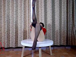 Nice Lady In Pantyhose And Heels Undresses For Striptease At The Round Table Desk, Revealing Big Pussy As Submissive Housewife Maid.