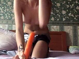 Dildo teen solo masturbates with toys.