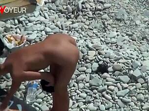 hot babe on the beach totally naked with buttplug in her ass?