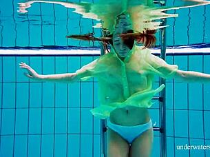 Nina Mohnatka boldly exposes her hairy pussy underwater in the shower