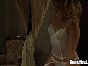 Nude slaves finger lesbian mistress's pussy.