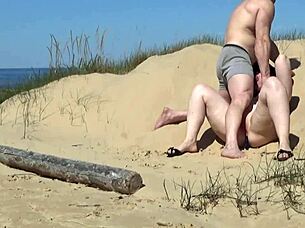 helping that juicy wife get fucked missionary on the beach by a bodybuilder