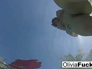 Olivia has some summer fun in the pool with blonde milf babe