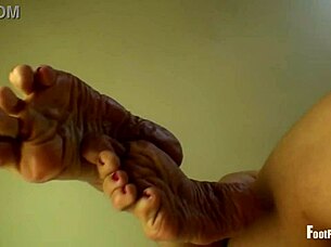 Jade Vixen slowly removes her black nylon hose and stockings