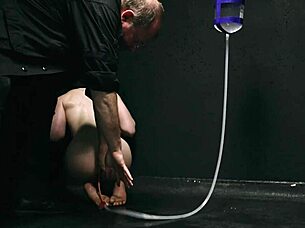 Bound naked in bondage getting enema close up on asshole!