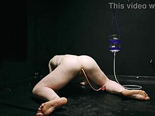 Bound naked in bondage getting enema close up on asshole!