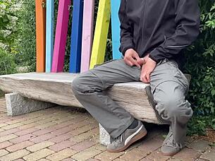 A mature woman risks being seen in the public park.