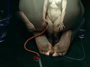 Bound naked in bondage getting enema close up on asshole!