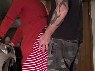 wife and husband have a moment in the laundry room