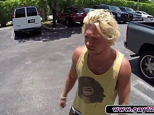 Blonde muscular bodybuilder surfs the waves boldly