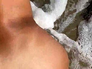 POV sex with friend's mom on beach and in hotel involves licking and anal fingering.