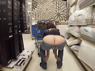 Housewife flashes huge asshole in public shop, staged by pornstar.