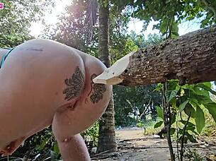 Shoving log in ass while horny