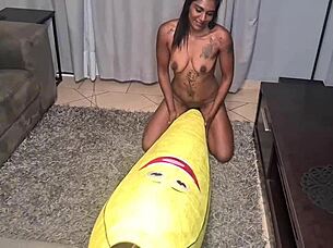 Look at this tattooed desi slut humping a big banana up close