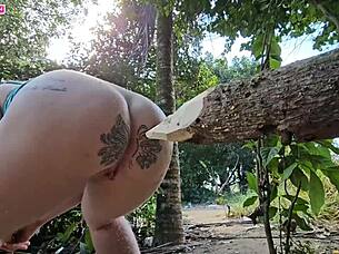 Shoving log in ass while horny