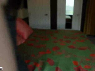 Mom compares sizes in bedroom