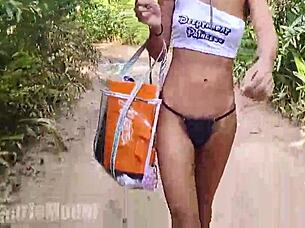 Walking topless in forest, hairy latina babe exposes small waist and pussy.