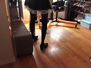 French maid vacuums house in stockings showing upskirt