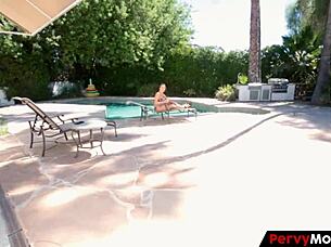 mom in bikini by the pool getting oiled