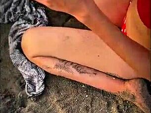 Stranger gives blowjob on public beach