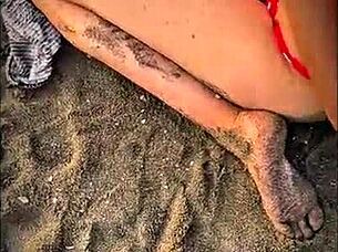 Stranger gives blowjob on public beach