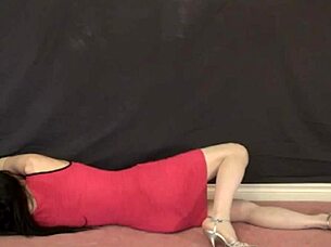 Pink front zipper minidress on the floor with a face mask