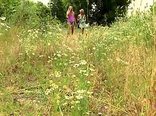 blonde duo explores outdoors with toys and tongues