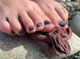 Goddess shows her messy nylon feet close up. Torn pantyhose on the river bank 😍