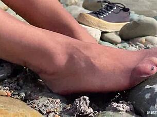 Goddess shows her messy nylon feet close up. Torn pantyhose on the river bank 😍