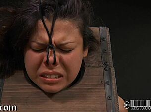 Girl Performs A Striptease Inside The Cage