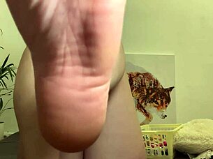 A blonde amateur girl shows her body and feet in a red outfit