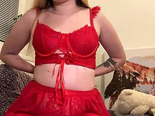 A blonde amateur girl shows her body and feet in a red outfit