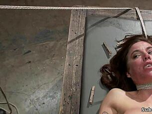 Damn, busty babe bent over gets ass caned in tight bondage!