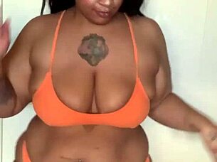 Ebony pornstar with big tits and ass dances in bikini, getting horny