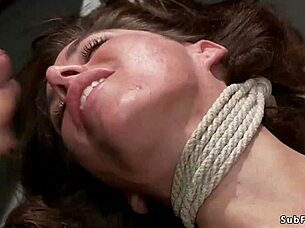 Damn, busty babe bent over gets ass caned in tight bondage!