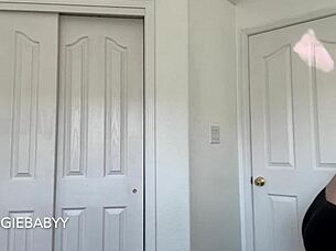 A girl is checking new T-shirts and tries them on with sexy underwear