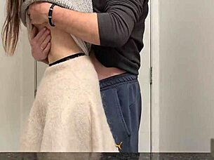 A petite girl in a miniskirt bends over in the public bathroom, moaning as she reaches orgasm.