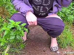 Lucia fingers her big tits in public outdoor challenge.