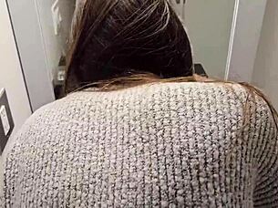 A petite girl in a miniskirt bends over in the public bathroom, moaning as she reaches orgasm.