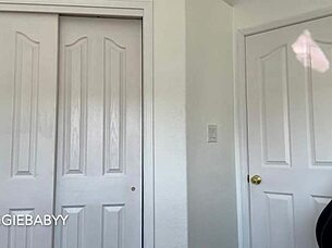 A girl is checking new T-shirts and tries them on with sexy underwear