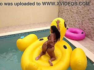 Maxine x sunbathes in the pool, playing with her wet pussy solo