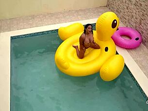 Maxine x sunbathes in the pool, playing with her wet pussy solo