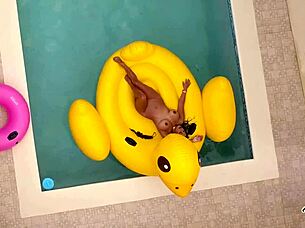 Maxine x sunbathes in the pool, playing with her wet pussy solo