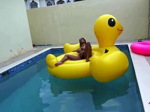 Maxine x sunbathes in the pool, playing with her wet pussy solo