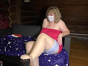 A mature housewife in a sex chat SHOWS OFF her chubby figure, legs in STOCKINGS, and big ASS under skirt