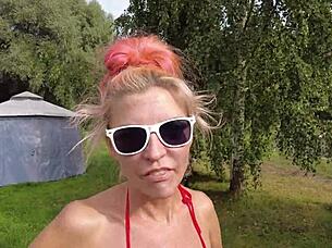 Tall Woman Wears Mesh Pink Monokini In Garden