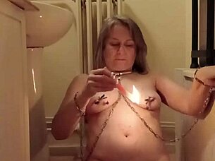 slave girl self-bonds with candle and piss play