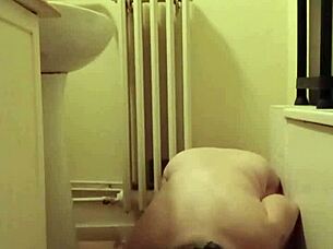 slave girl self-bonds with candle and piss play