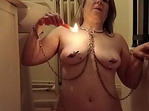 slave girl self-bonds with candle and piss play