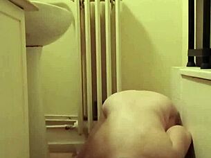 slave girl self-bonds with candle and piss play